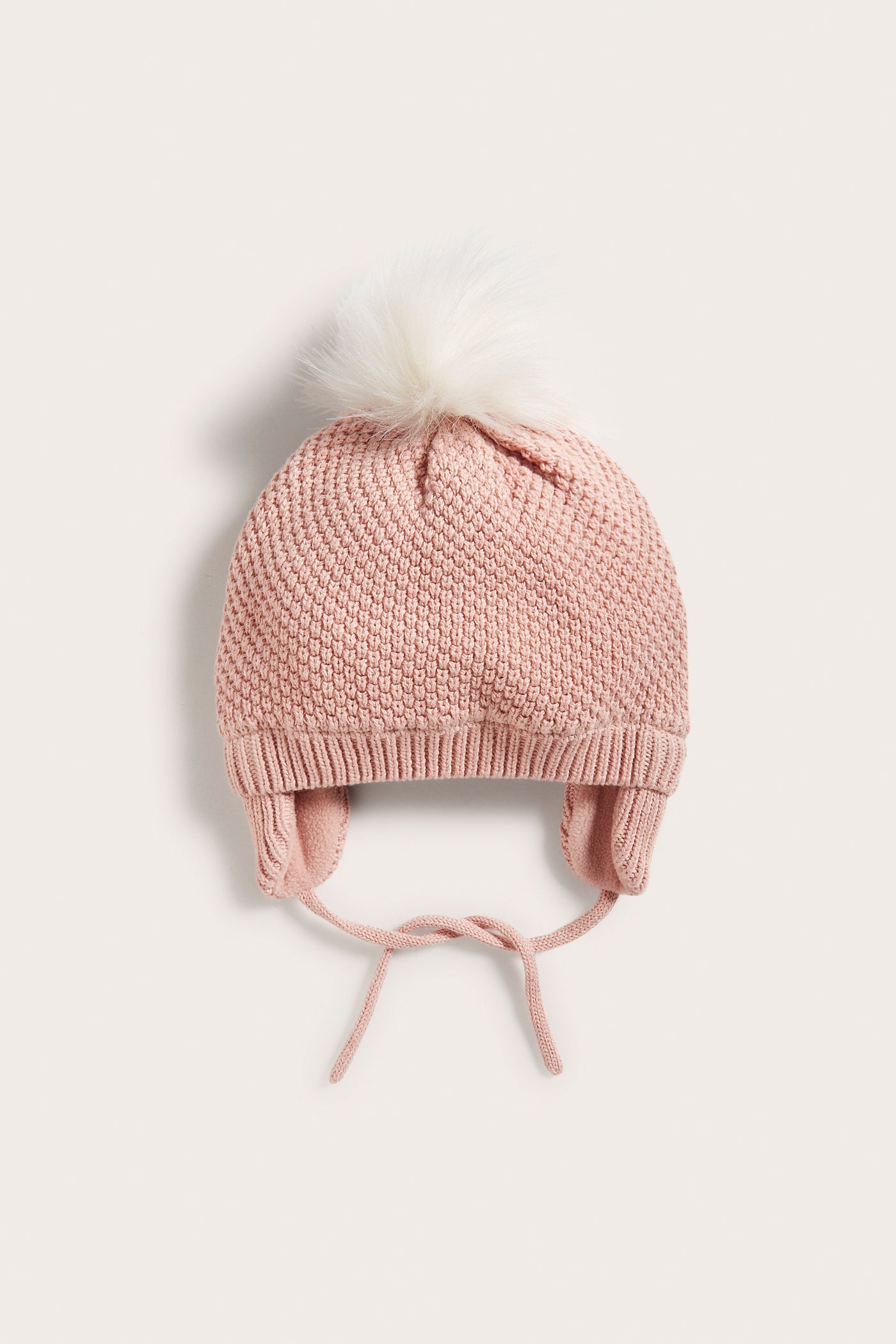 Baby pink knitted pom-pom hat with ear flaps